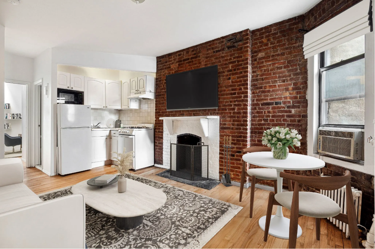 Living area with fireplace and kitchen 426 West 48th Street, New York, NY
